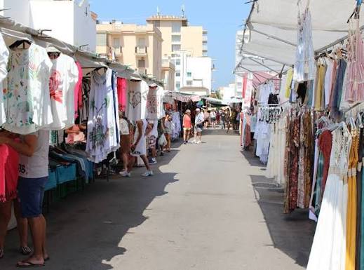 Woven baskets and scarves on display at the market