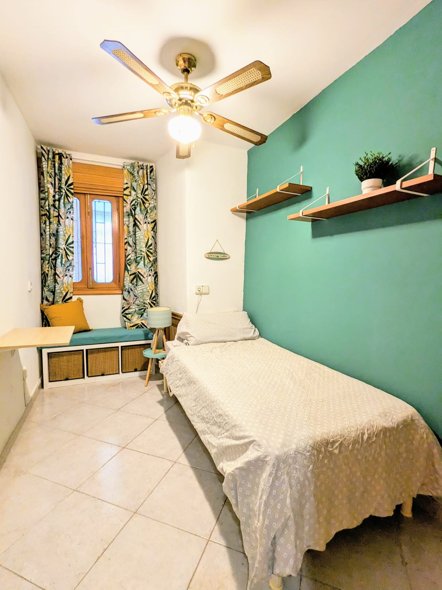 Private Budget Room with calming green walls and twin bed
